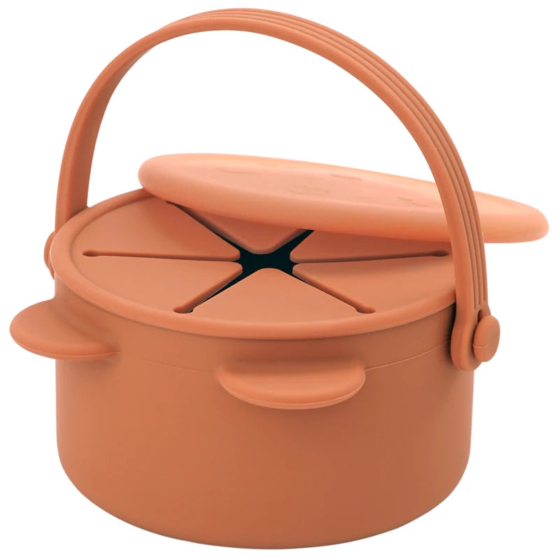 Terracotta-colored lunch box with a handle on a white background