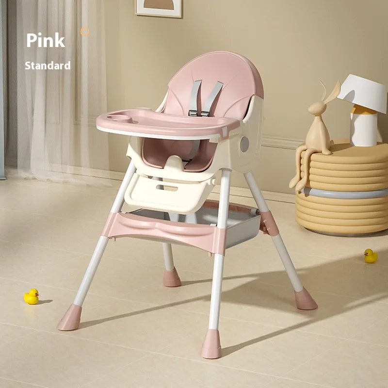 Pink baby high chair on a beige floor with toys around