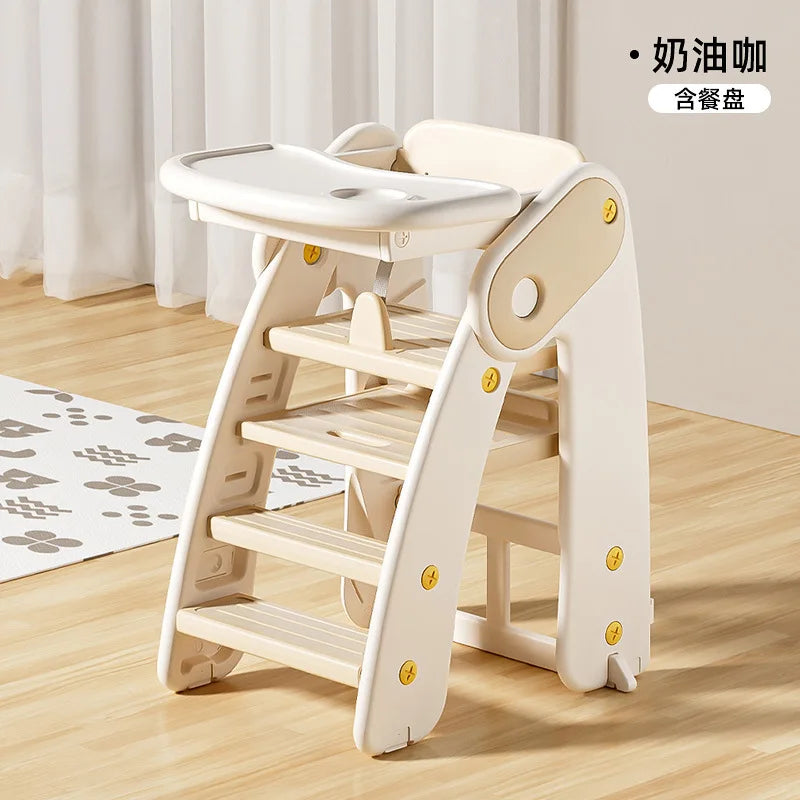 Wooden children's step stool with a tray on a wooden floor.