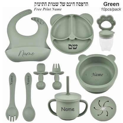 Set of green baby utensils with customizable name options on a white background