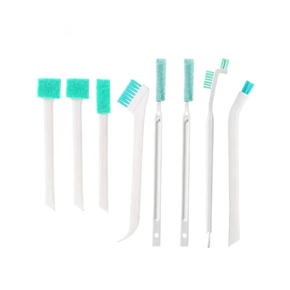 Set of dental cleaning tools with green bristles on a white background