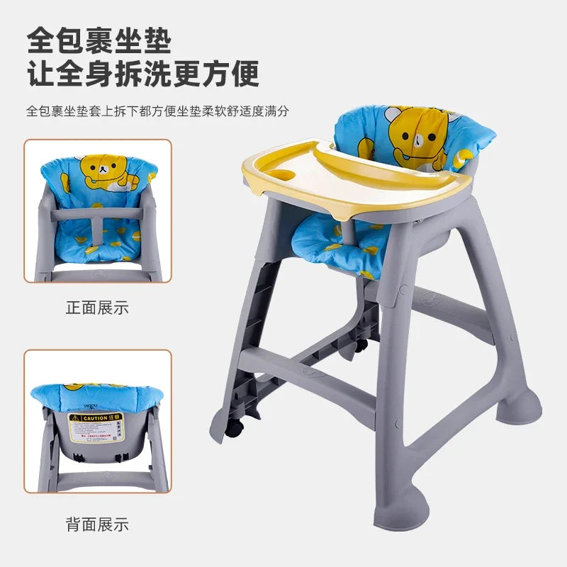 Baby high chair with cartoon seat cover on a white background