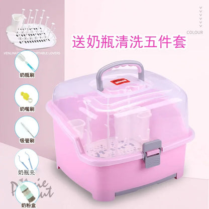 Pink storage box with cleaning tools on a light pink background