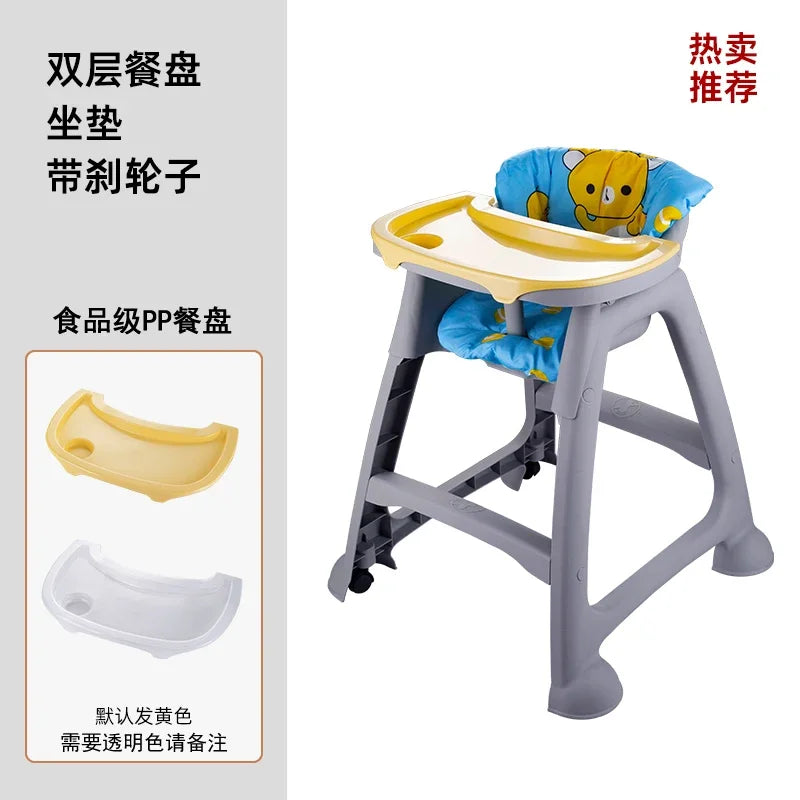 Children's high chair with detachable tray and wheels, featuring a cartoon character cushion.