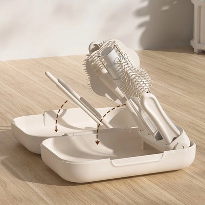 White hair styling tool set on a wooden surface