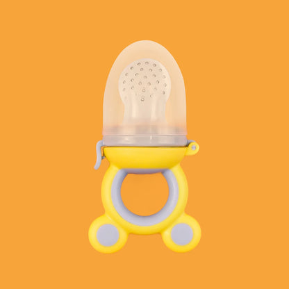 Yellow and clear baby pacifier on an orange background