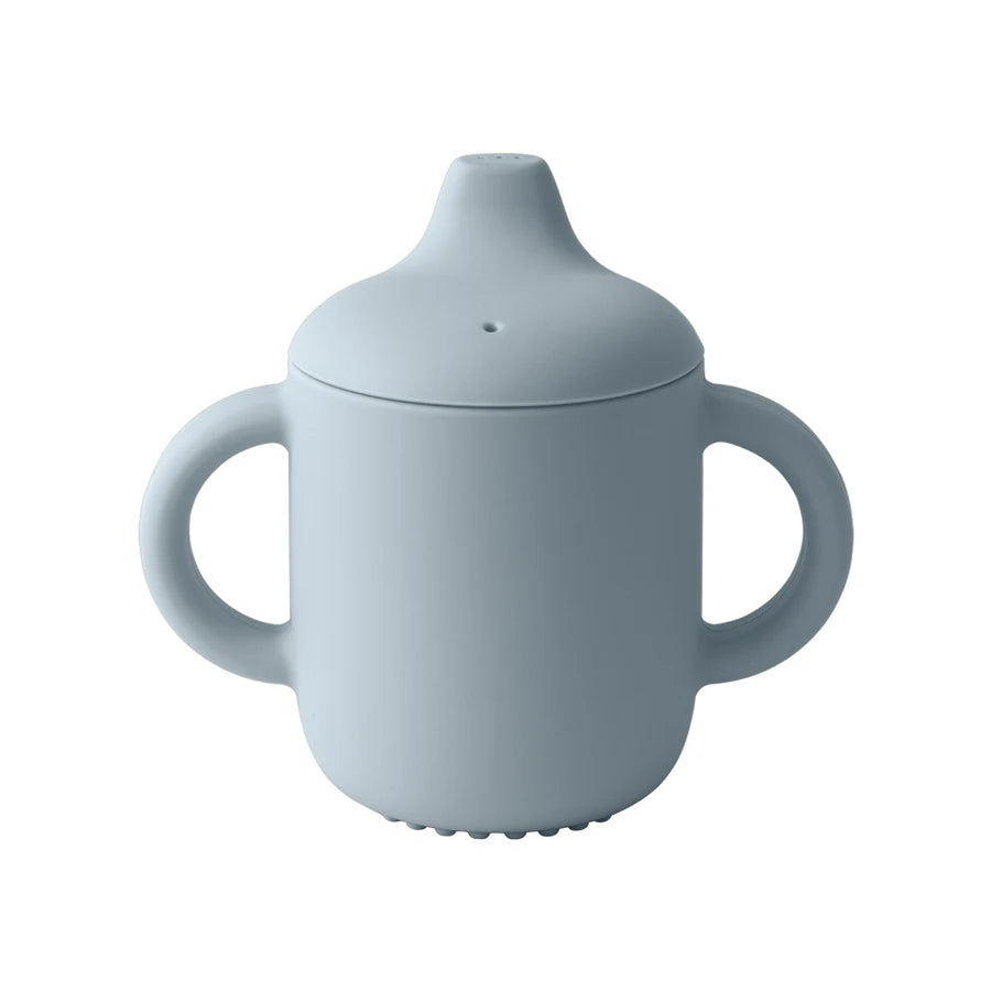 Light blue sippy cup with lid on a white background