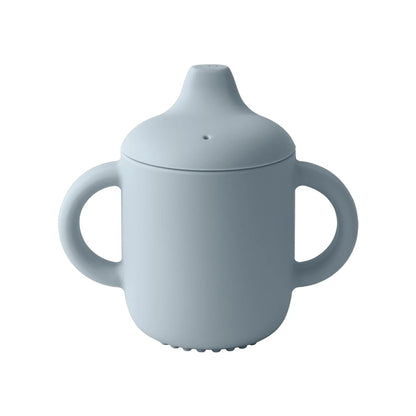 Light blue sippy cup with lid on a white background