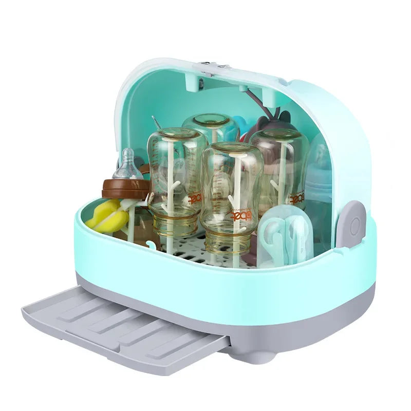 Baby bottle sterilizer with bottles and accessories inside on a white background