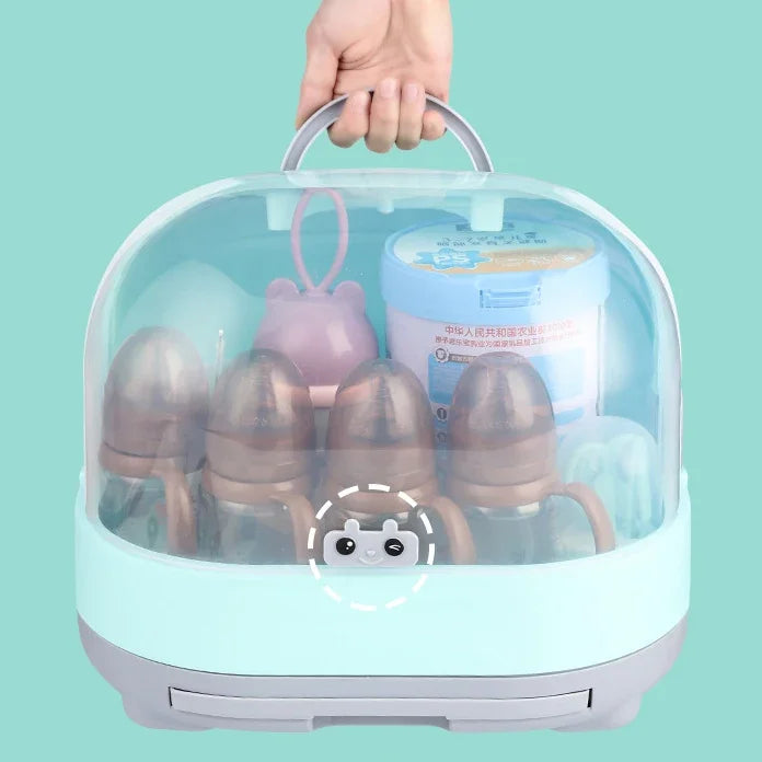 Baby bottle sterilizer with bottles inside on a teal background