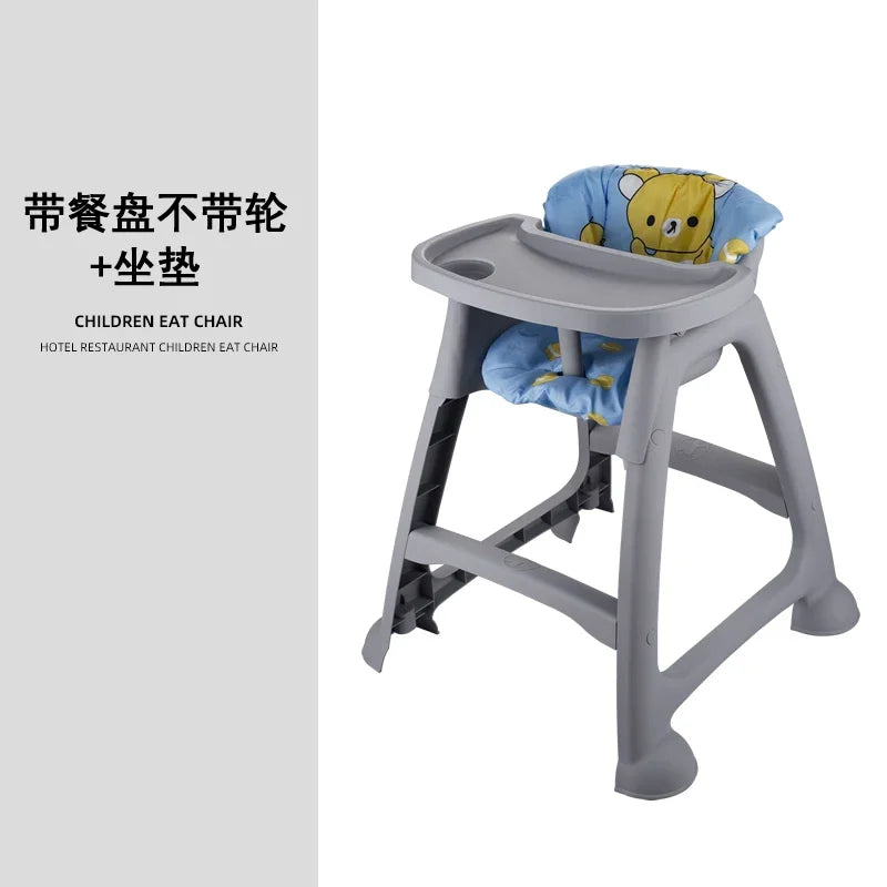 Children's high chair with cartoon seat cover on a white background