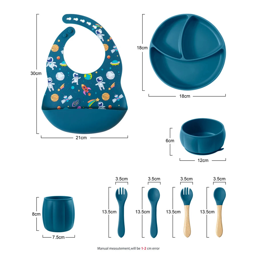 Baby mealtime set with bib, plate, bowl, cup, and utensils with measurements on a white background.