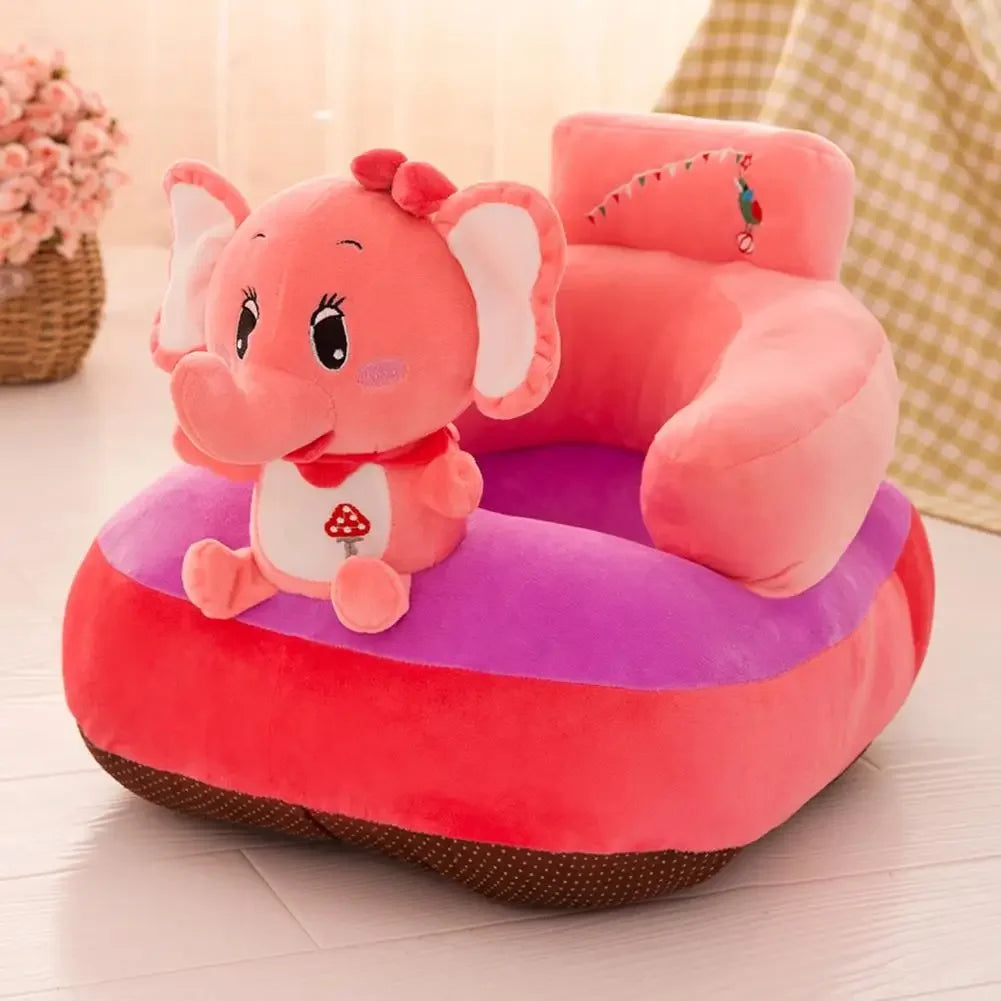 Pink elephant-shaped children's seat on a light wooden floor with a blurred background
