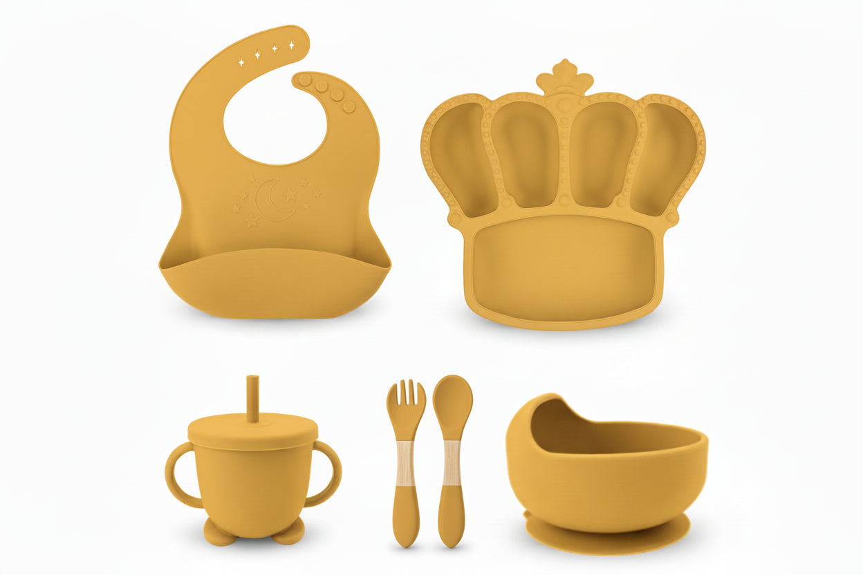 Yellow baby feeding set with customizable name on various items against a white background.