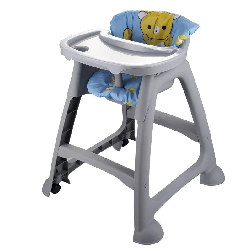 Gray high chair with blue cushion featuring a teddy bear design on a white background